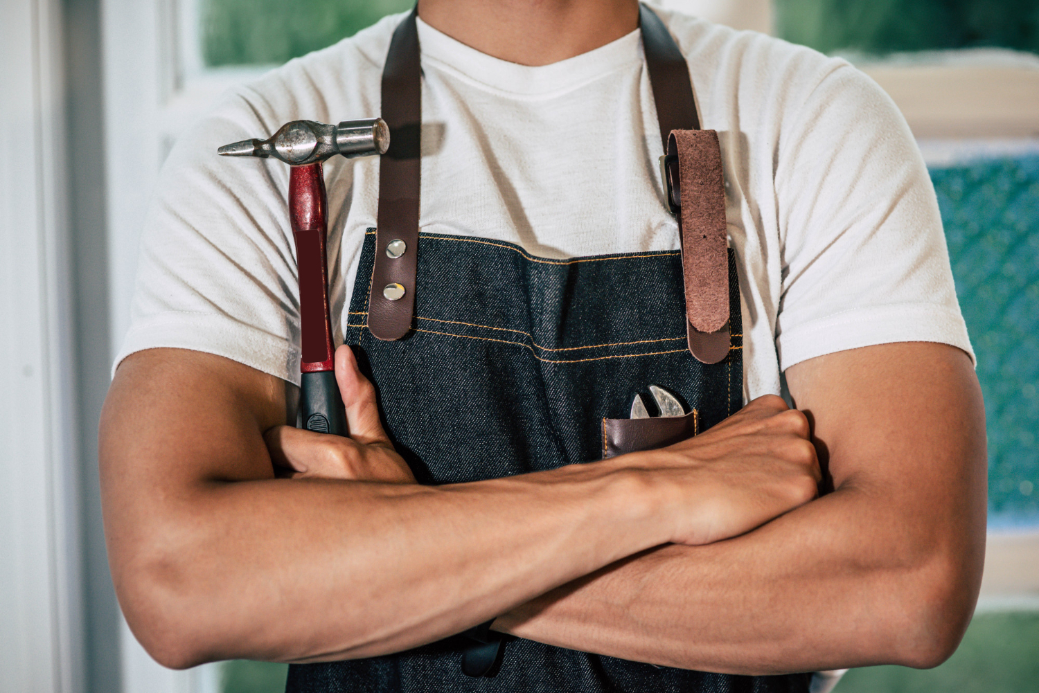 Professional handyman fixing a kitchen cupboard in a Middlesbrough home
